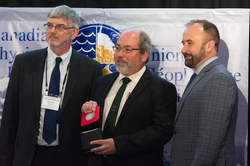 John Pomeroy (center) receives John Tuzo Wilson Medal at the Canadian Geophysical Union annual meeting on May 31. (Left: Howard Wheater, Right: Richard Petrone, Photo credit: Chris Marsh)