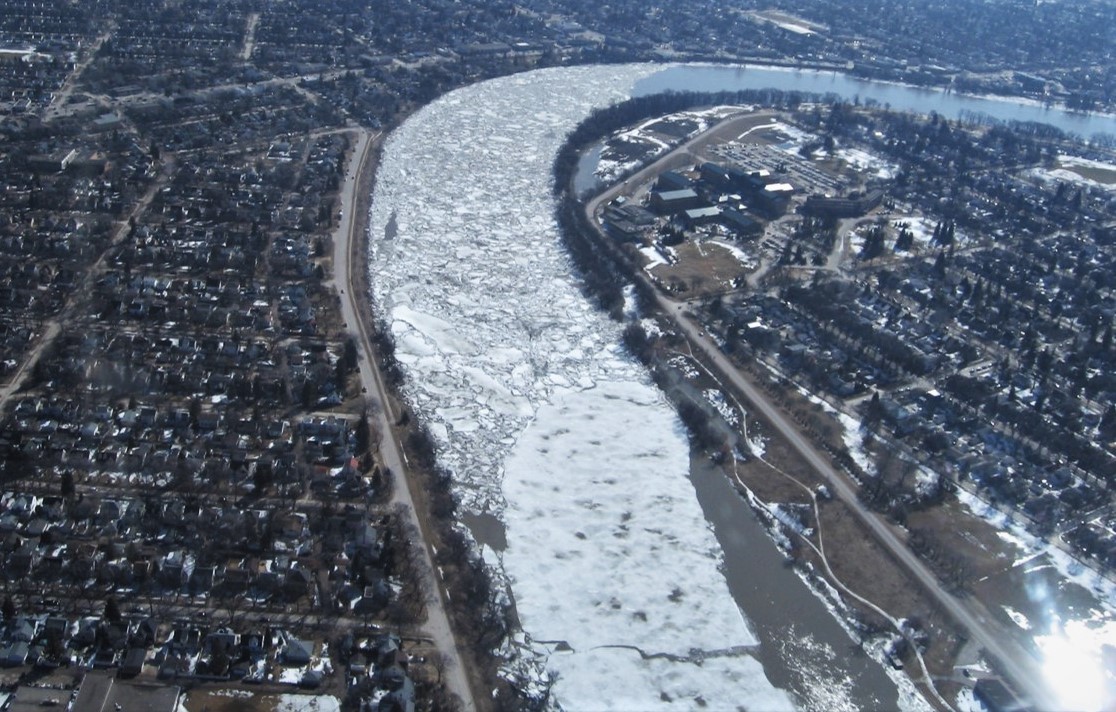 Photo: Ice accumulation and jamming in Winnipeg, Manitoba [by Dr. Karl-Erich Lindenschmidt] 