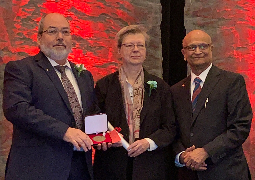 John Pomeroy (left) receives the Miroslaw Romanowski Medal from the Royal Society of Canada
